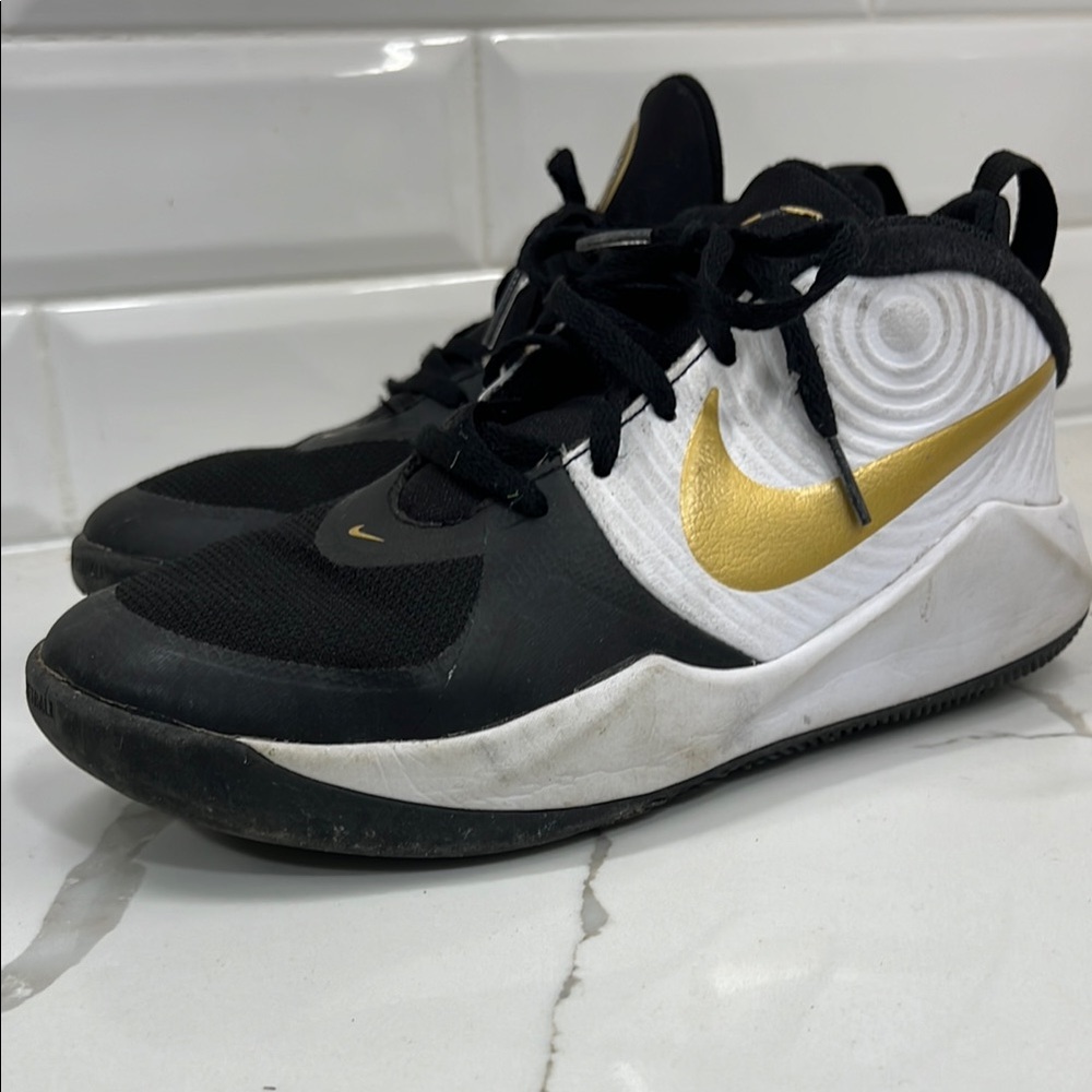 Nike Black and Gold Sneakers Modern Design